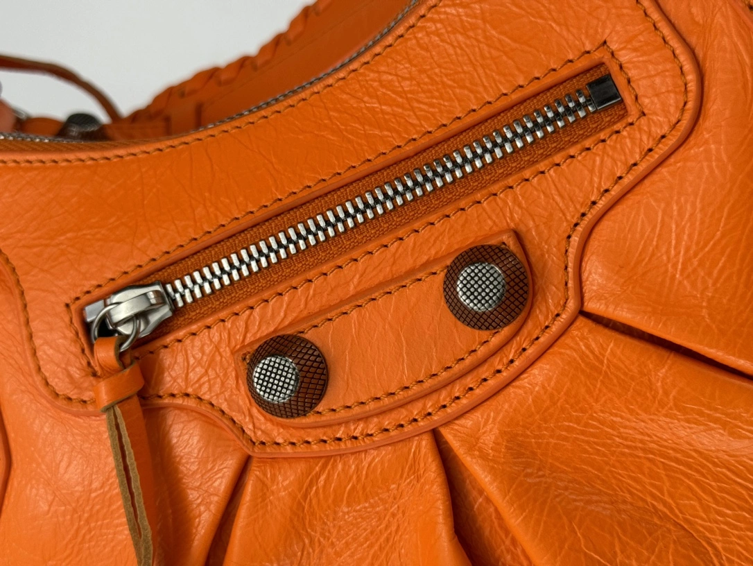 Balenciaga Le Cagole Half-Moon Dumpling Bag in Oil Wax Orange Breathable 61108